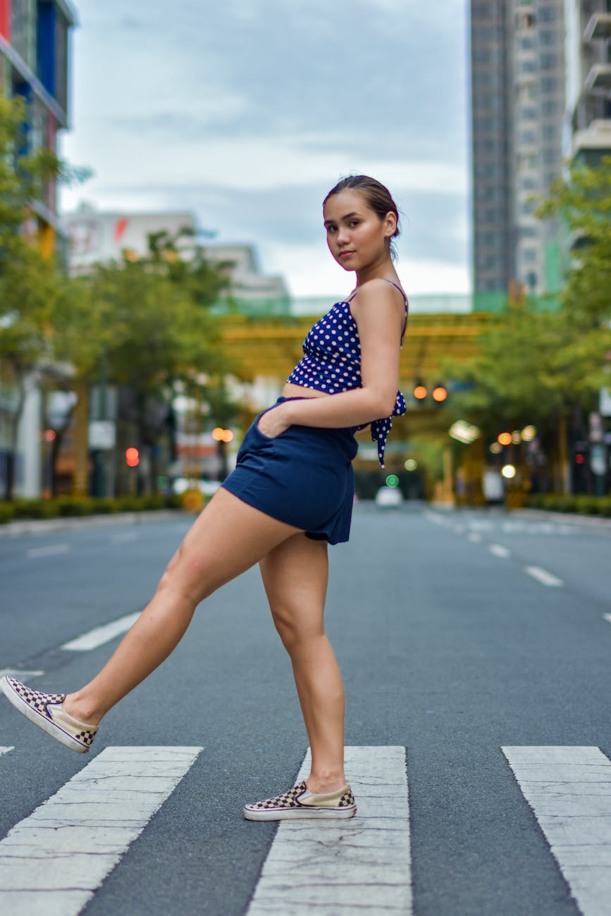 photo of woman crossing the street