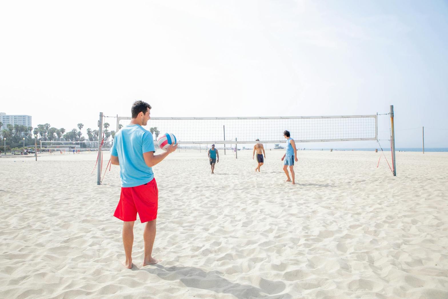 people playing beach volleyball